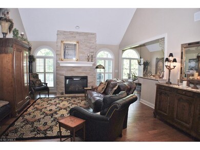 Warm hand scraped wood floors flow throughout the 