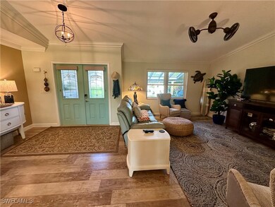 Entrance foyer featuring crown molding and wood fi