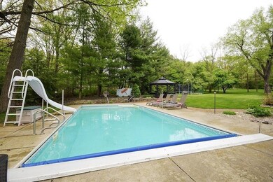 In-ground pool with water slide, automatic cover and basketball hoop!