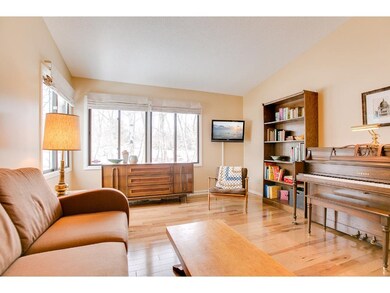 Immaculate hardwood floors and large windows make 