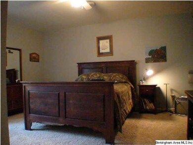 Very large second bedroom with view of wooded lot