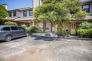 View of front of house with brick siding, uncover