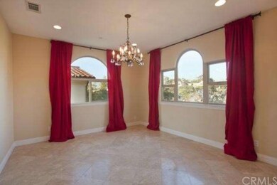 Formal dining room with treetop view