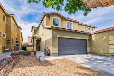 View of front of home with stucco siding, a garage