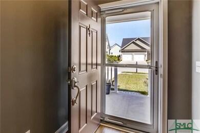 Separate storm door with entry into foyer that is 