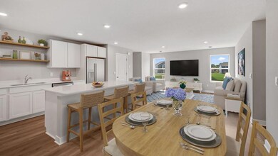 The spacious living room flows seamlessly to the dining and kitchen. Photo of actual home!