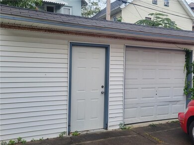 Currently a single car with extra storage space, the garage could be modified to hold two cars.