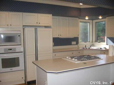 Kitchen. KITCHEN HAS SOLID SURFACE COUNTERTOPS AND