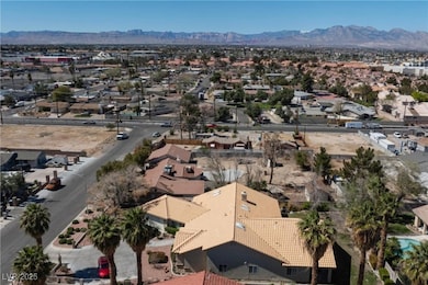 Aerial view of residential area featuring a mountain backdrop