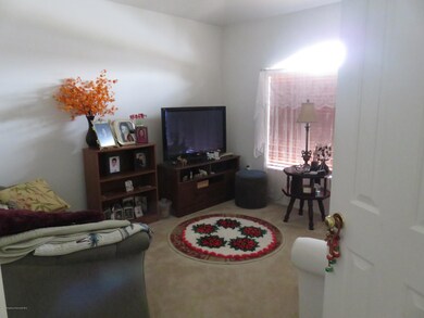 Den to the left of Foyer (12x14)