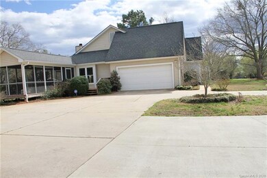 Two car side load garage, deck, huge screen porch 