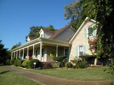 Beautiful landscaping surrounds this well cared for home.