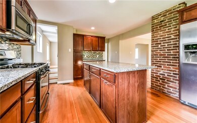 Updated huge kitchen with cherry cabinetry and sta