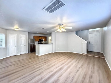 Unfurnished living room with visible vents, light