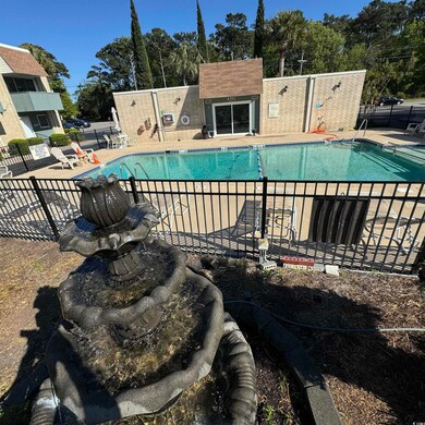 Pool featuring a patio and fence