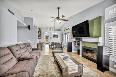 Living room featuring baseboards, visible vents, v
