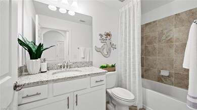 Full bathroom featuring toilet, shower / tub combo