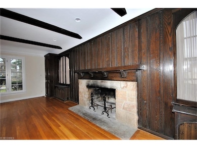 LIVING ROOM FEATURES ORIGINAL OAK PANELING AND SAN