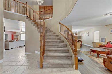 Stairs with tile patterned flooring, visible vents