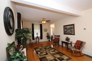 Large Living Room With Wood Flooring