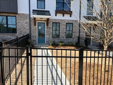 Front Door and Fenced in Front Yard to townhome on