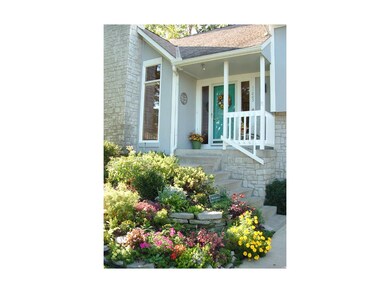 Gorgeous, easy-care landscaping surrounds this bea