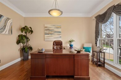 Office has french doors, hardwood flooring, crown 