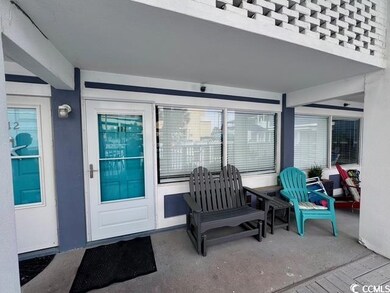 Entrance to property featuring stucco siding