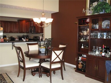 Dining area open to living room and kitchen.