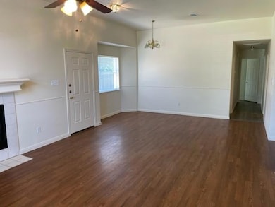 Unfurnished living room with wood finished floors