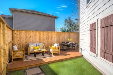 Big yard with a fence and turf.