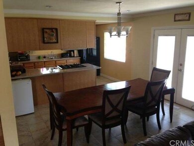 Dining room, with kitchen in background.  Notice t