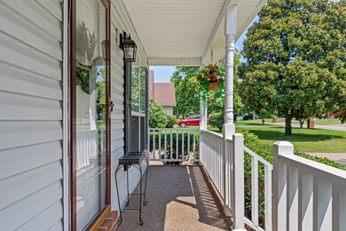 Covered front porch protects house from the elements and is great to sit on (especially in the rain!)