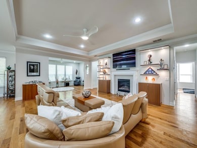 Living room with a raised ceiling, ornamental mold