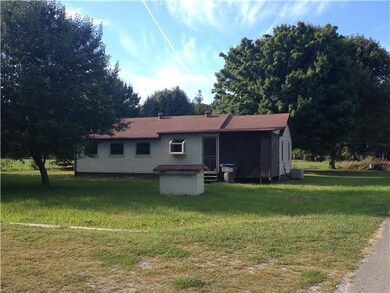 Back yard note screened in porch! 2nd driveway in foreground to 2nd garage door bay.