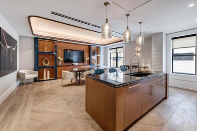 Kitchen with pendant lighting, a center island wit