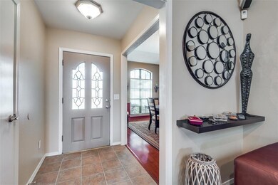 Front door with formal dining room to the left as 