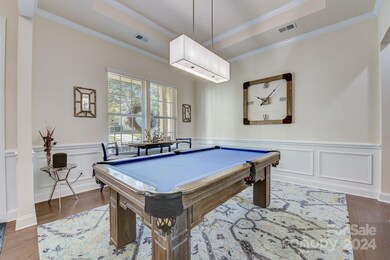 Dining room being utilized as a game room