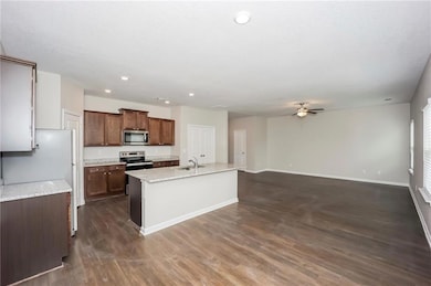 Kitchen featuring stainless steel appliances, a si