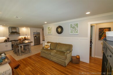 Formal living room with hardwood floors.