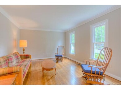 Formal living room with crown molding.
