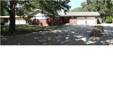 Surrounded by large shade trees