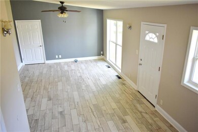 Entryway featuring visible vents, baseboards, ligh