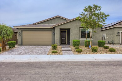 View of front of property with driveway, a garage,