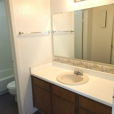 The Bathroom with a Big Vanity has a door separati