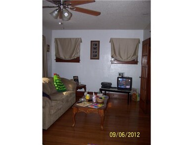 Living Room upper front apt; Living room with all 