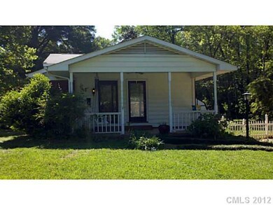 Exterior Front - Side covered porch.