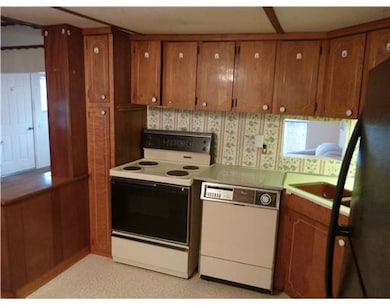 Kitchen. Workspace, storage, and open to dining area