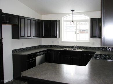 Kitchen - Black Cabs & Tile Backsplash