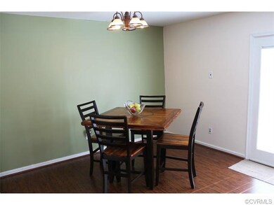 Dining area with laminate floors.